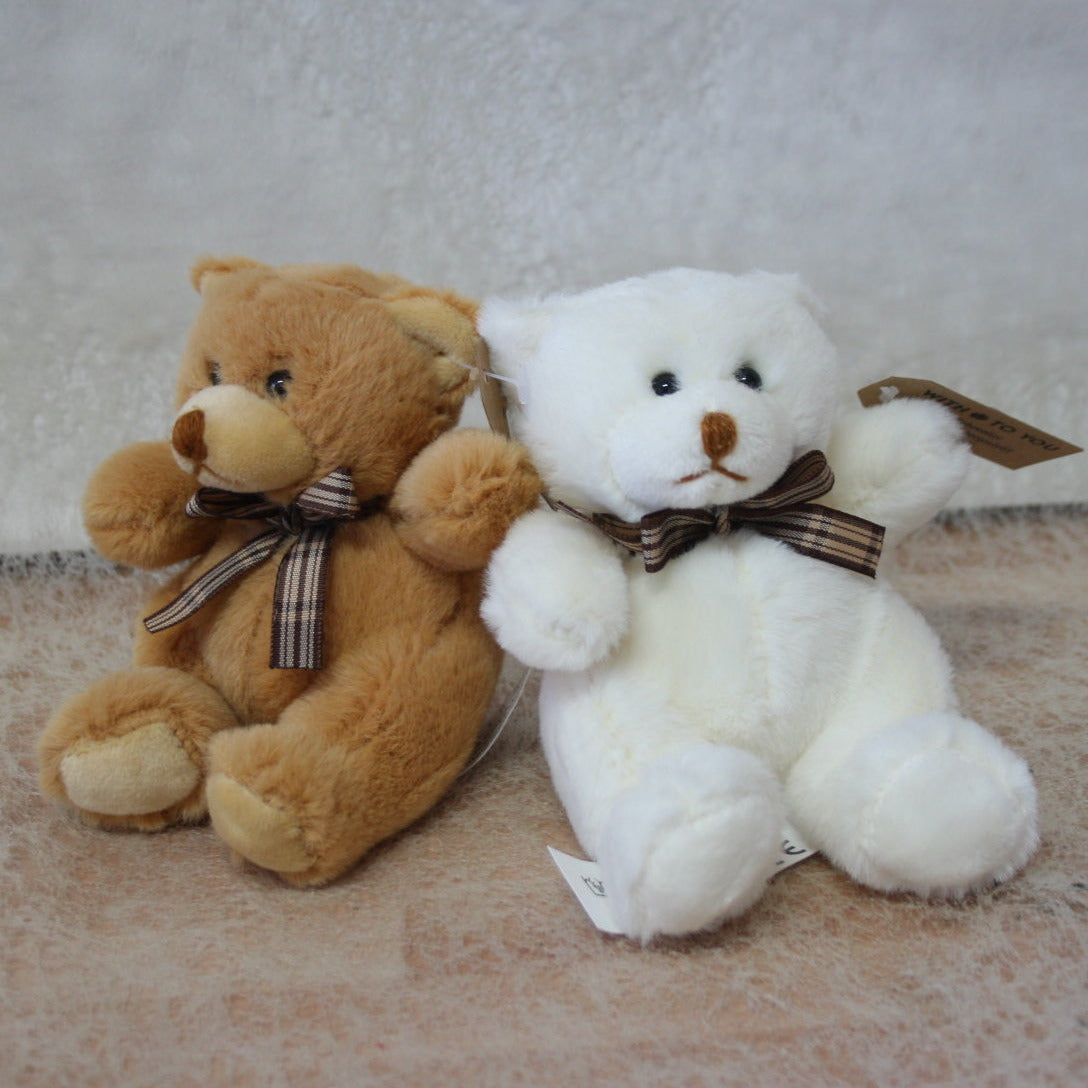Oso de 10 cm en color blanco y marrón.